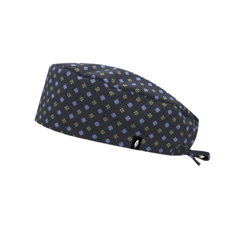 Gorro quirúrgico de pelo corto de la colección ARTE, con diseño geométrico y floral en tonos oscuros y sutiles, fabricado en algodón por Robin Hat.