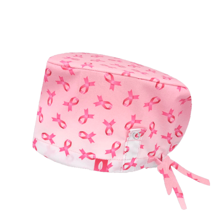 Gorro quirúrgico AGATHE con lazo rosa, símbolo de la lucha contra el cáncer de mama, y tecnología Click & Mask para un ajuste cómodo de mascarilla.