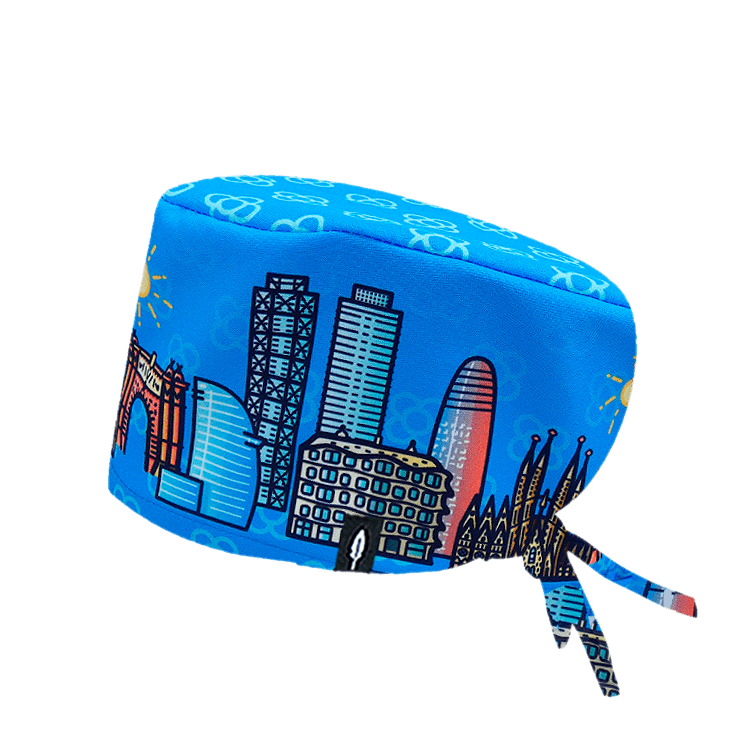 Gorro quirúrgico BARCELONA con diseño exclusivo de monumentos como la Sagrada Familia y Arco del Triunfo en tonos vibrantes sobre fondo azul