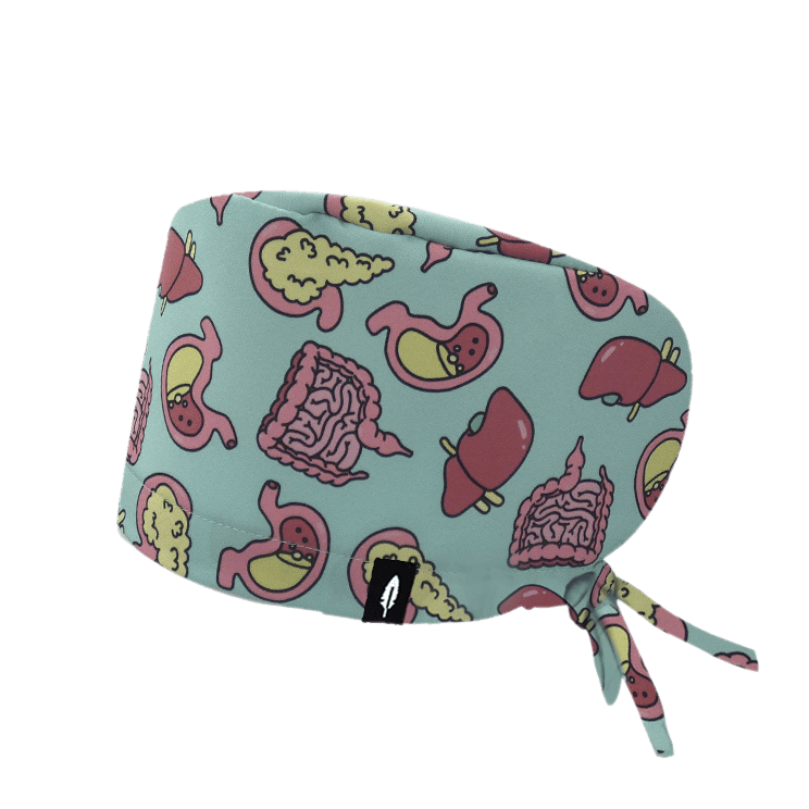 Gorro quirúrgico Digestive con diseño del sistema digestivo en fondo verdes y toques rosados y amarillos, fabricado en poliéster transpirable.