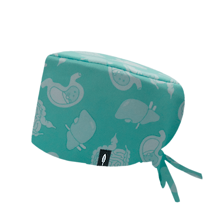 Gorro quirúrgico Digestive con diseño del sistema digestivo en fondo verdes claros y toques rosados y amarillos, fabricado en poliéster transpirable.