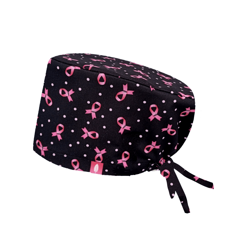 Gorro quirúrgico de pelo largo ELISABETH BLACKBURN de Robin Hat, confeccionado en poliéster técnico, con lazos rosas sobre fondo negro, ideal para profesionales solidarios y elegantes.