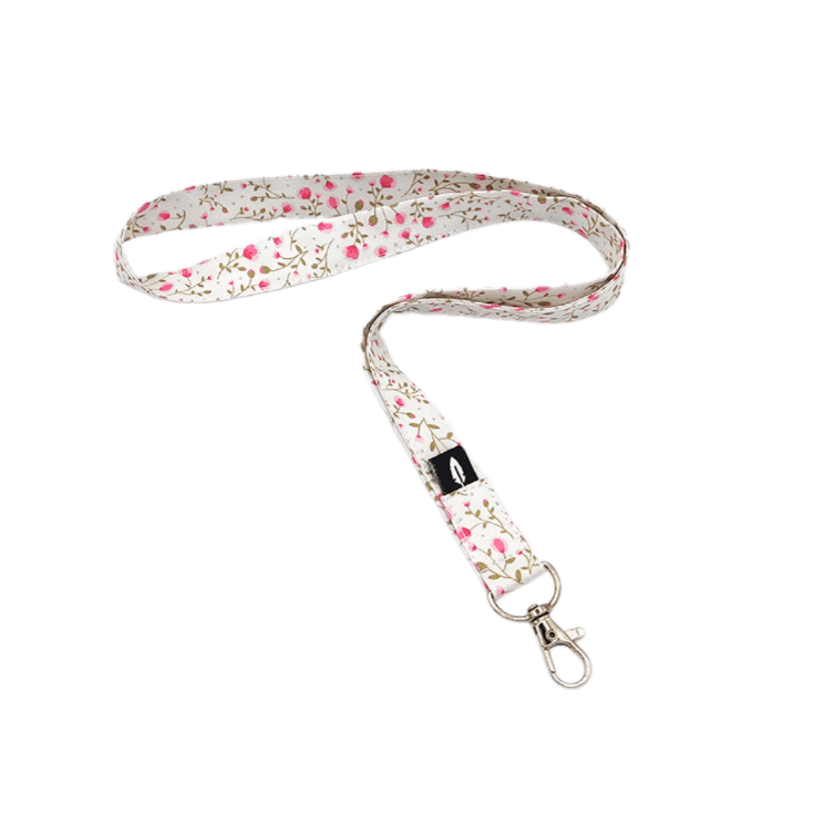 Lanyard CARLOTA de poliéster con un delicado diseño floral, ideal para profesionales sanitarios.