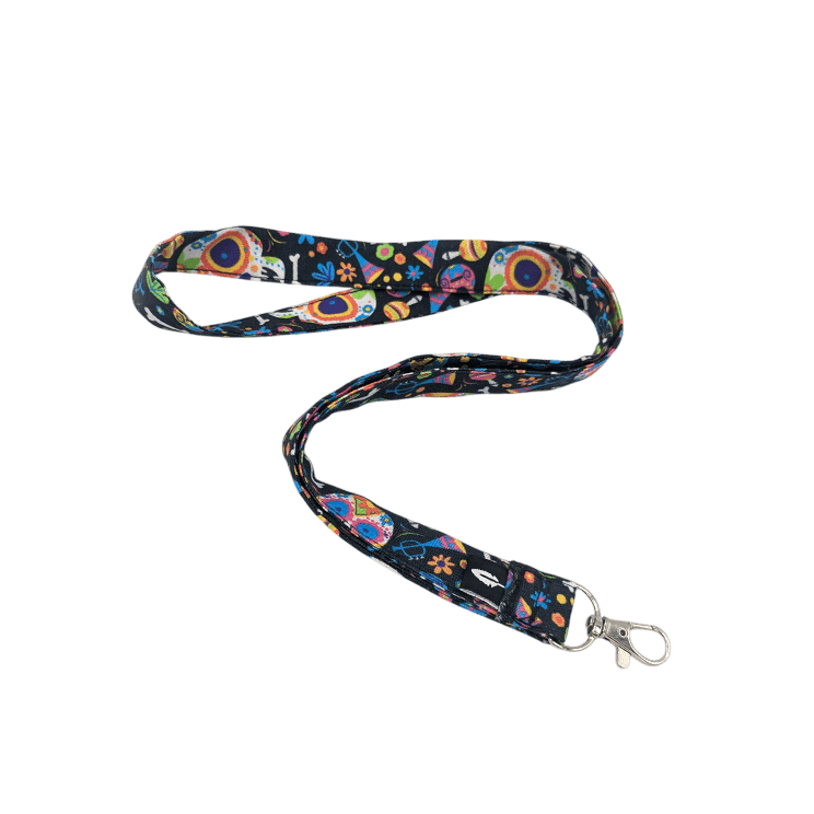 Lanyard CATRINA de Robin Hat, confeccionado en algodón 100% con un diseño vibrante inspirado en el Día de los Muertos.