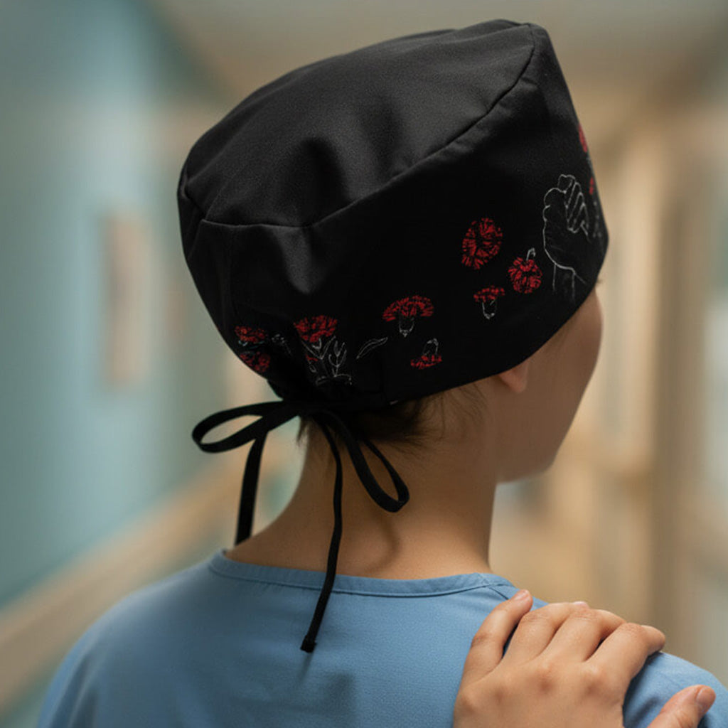 Gorro quirúrgico Manos Que Cuidan negro con manos protectoras y claveles rojos - Simboliza vocación sanitaria Robin Hat