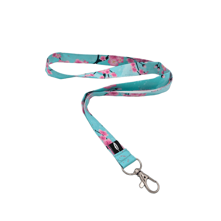 Lanyard Sakura sin fondo, con estampado floral en tonos pastel.