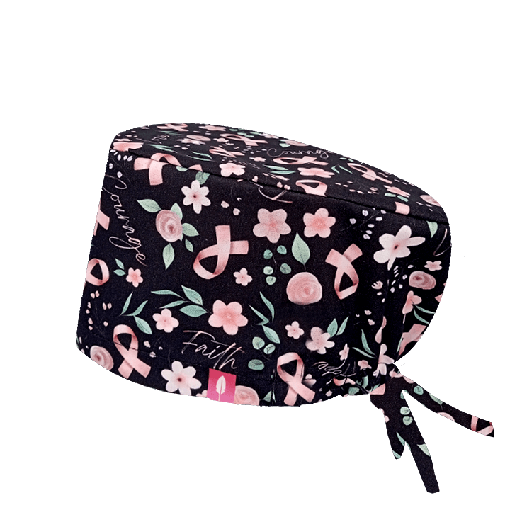 Decorado con lazos rosas sobre fondo negro, representa la lucha contra el cáncer de mama con elegancia y fuerza.